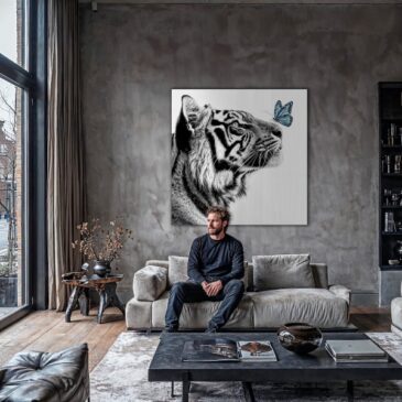 Black and white photo of a tiger with butterfly