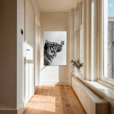 Black and white photo of a tiger with butterfly